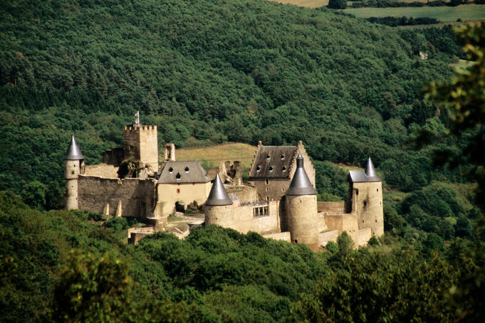 Castle set amongst forested slopes in Luxembourg Ardennes.