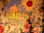 Boy standing against mural.
