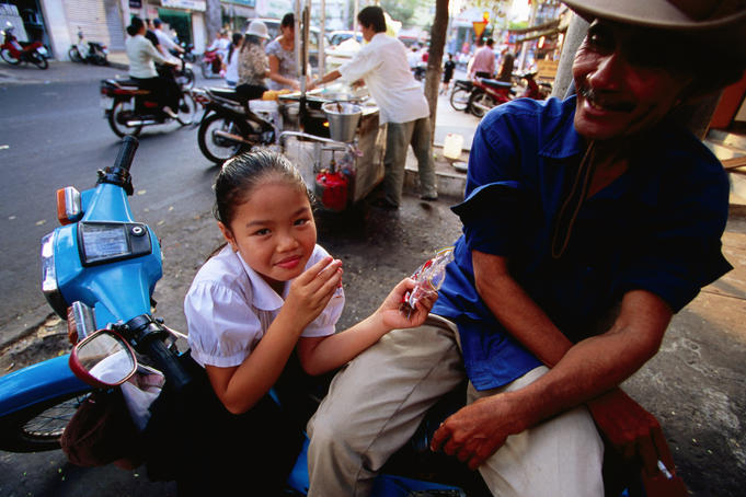 Girl enjoys after school snack.