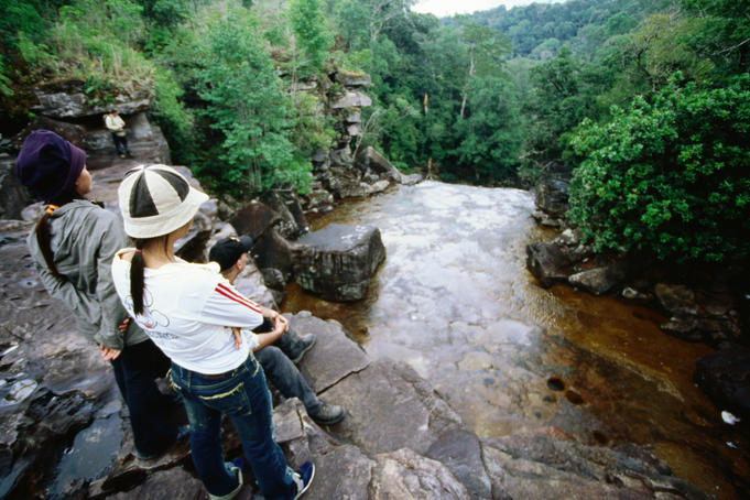 Visitors at top of waterfall.