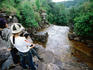 Visitors at top of waterfall.