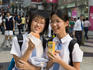 Schoolgirls with snacks.