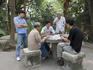 Men playing cards, Camoes Garden.
