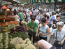 Women at vegetable stand, near Red Market.