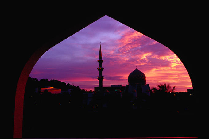 State mosque silhouetted at sunset.