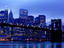 Brooklyn Bridge and Manhattan skyline from Brooklyn at dusk.