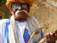 Man with turban playing Sarangi, Asia