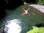 Big jump into deep swimming hole, Togitogiga Waterfall.