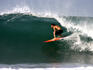 Travelling surfer looks for the barrel at wave known as 'Indicators'.