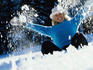Woman throwing snow in air.