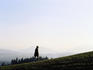 Woman walking in hills.