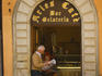 A local reads the daily paper at Aries Cafe, Montone.