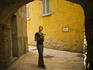 Woman using guide book whilst looking at the architecture.