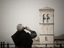 Man photographs nearby church, Chiesa di Santa Maria Maggiore.