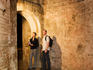 Man and woman look at the walls of the underground city.