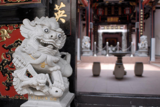 Intricately carved lion at entrance to Eng Choon Association, an ancestoral home.