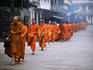 Monks on Tak Baat,or alms round, collecting food in morning.
