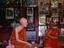 Monk with abbot, temple library, Laos
