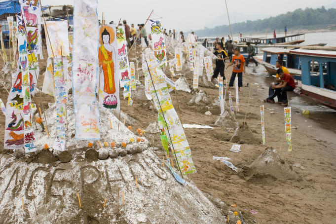 Decorated sand stupas on beach during Pi Mai Lao ( Lao New Year), Don Sai Mung Khun.