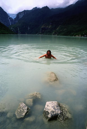 Tourist swimming in a lake - Queulat Parques Nacional, Aisen del General Carlos Ibanez del Campo