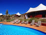 Swimming pool and tent chalets at Longitude 131 Lodge, Ayers Rock Resort.