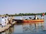People walking from the boat to the shore, Tuti Island.