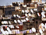 Satellite dishes on rooftops.