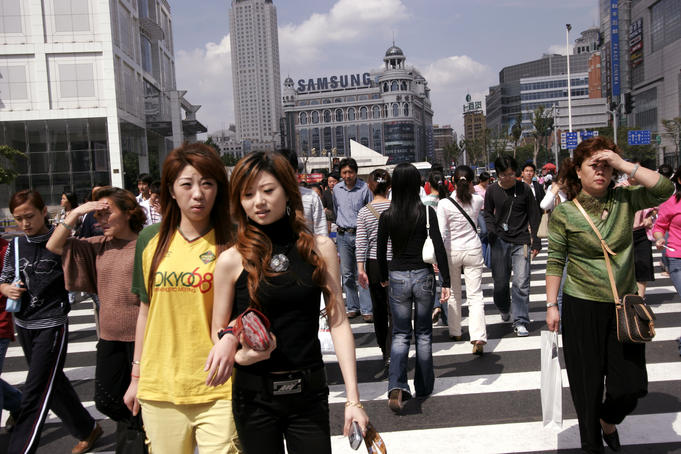 Crowds crossing street near People's Square (Ren Min Square).