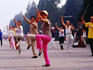 People practicing tai-chi in Temple of Heaven Park.
