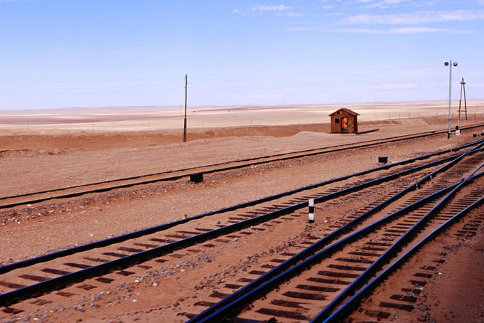 Train tracks and barren countryside from Trans-Mongolian train.