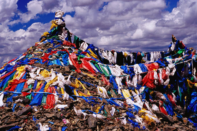 Ovoo, a shamanistic collection of stones and prayer flags, beside the road bwtween Ulaanbaatar and Kharkhorin (Kharakorum).