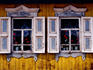 Detail of exterior wall of wooden cottage on Gudine Street in Listvyanka village on Lake Baikal.