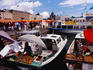 Selling fruit and vegetables from boats, kauppatori (fish market) on the harbour.