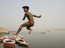 Boy jumping into Ganges.