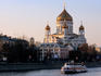 Moscow River cruise boat passing Cathedral of Christ the Saviour.