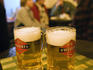Two glasses of Weifert local beer at a traditional Balkan tavern named '?'.