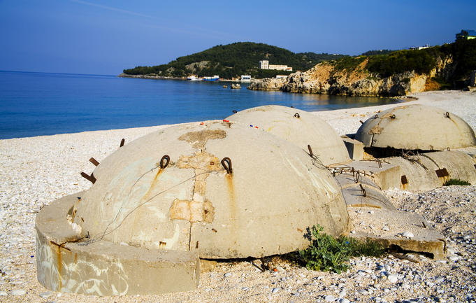 Bunkers on beach at resort town of Himara.