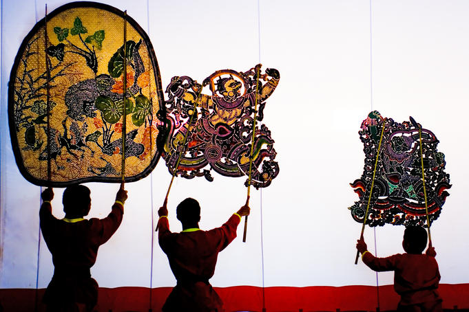 Performance of Nang Yai (large shadow puppets) at Wat Khanon temple.