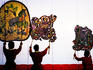 Performance of Nang Yai (large shadow puppets) at Wat Khanon temple.