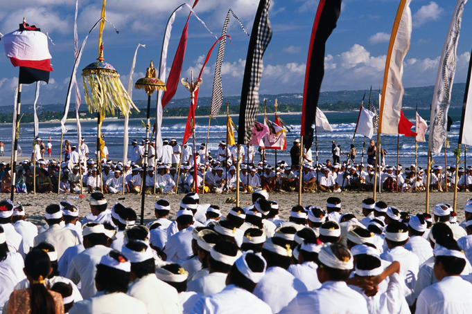 Melasti ceremony on Kuta Beach celebrating Balinese New Year.