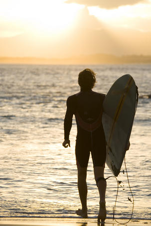 Heading out for a sunset surf at the Pass.