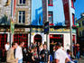 People relaxing at an outdoor pub.