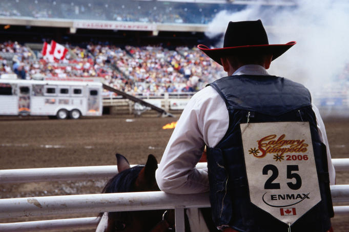 Cowboy awaits his ride, Calgary Stampede.