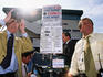 Bookmaker looking through binoculars at Galway Races.