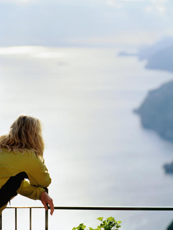 Woman looking across the sea.