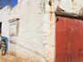 Children standing by house in old town.