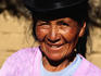 Indigenous woman in traditional bowler hat.