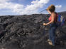 Woman near recent lava flow on South Coast.