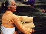 Seated women at Tanah Lot temple.