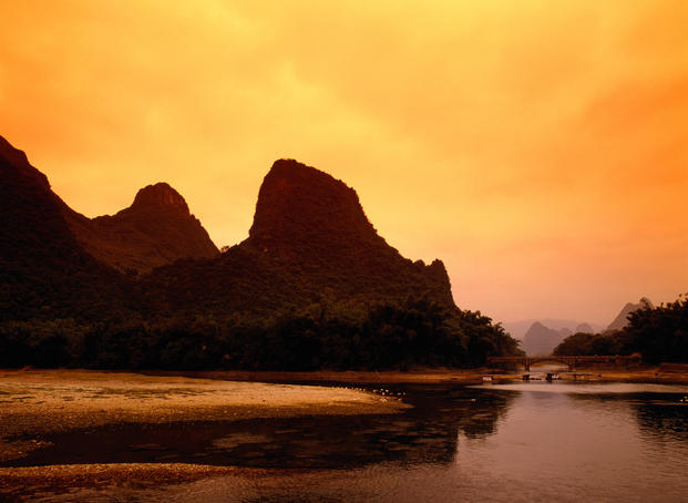 Li River with mountains in distance.
